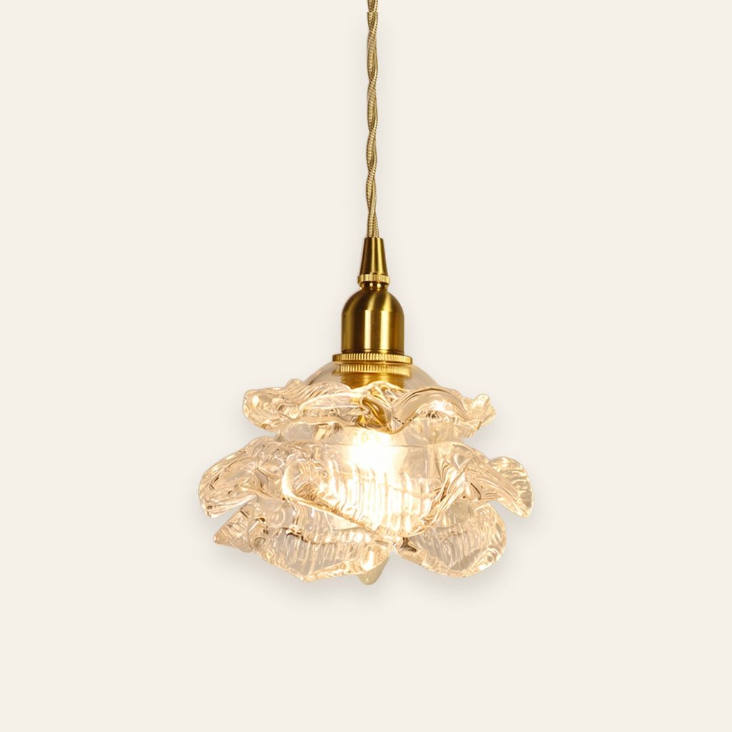 Thorpeness rose glass pendant light in clear glass on a brass finish holder, lit