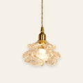 Thorpeness rose glass pendant light in clear glass on a brass finish holder, lit