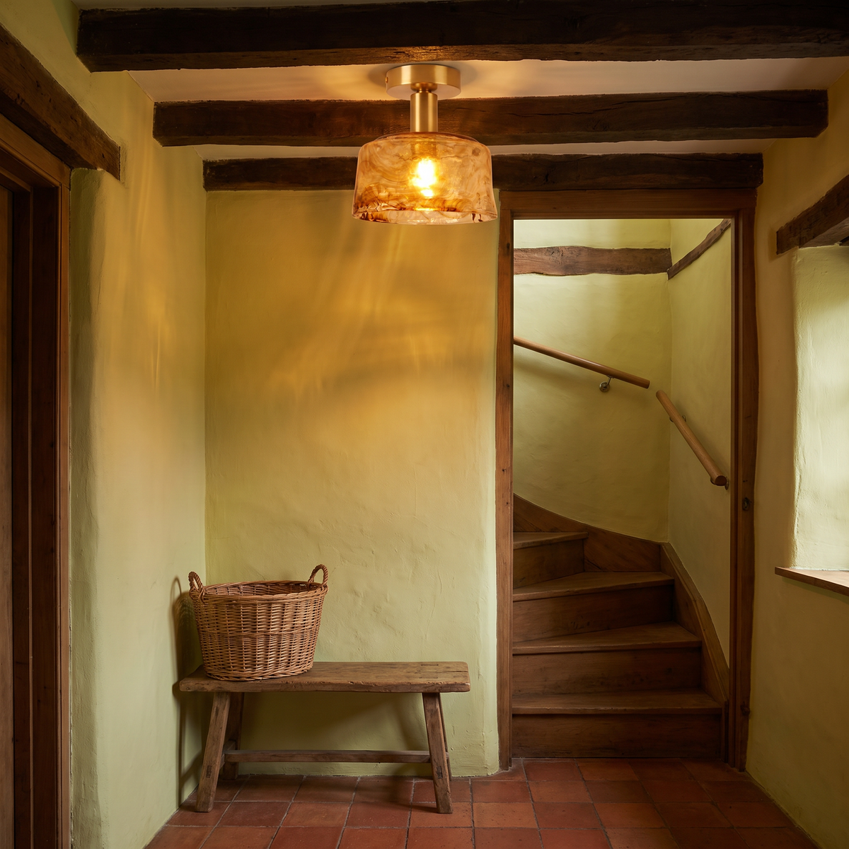A lit Walpole marbled amber semi flush ceiling light in a cottage hallway