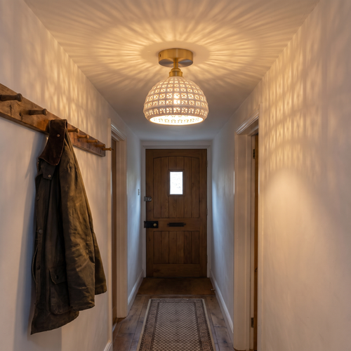 A lit Wangford ceramic lattice ceiling light in a cottage hallway with a lattice pattern on the ceiling