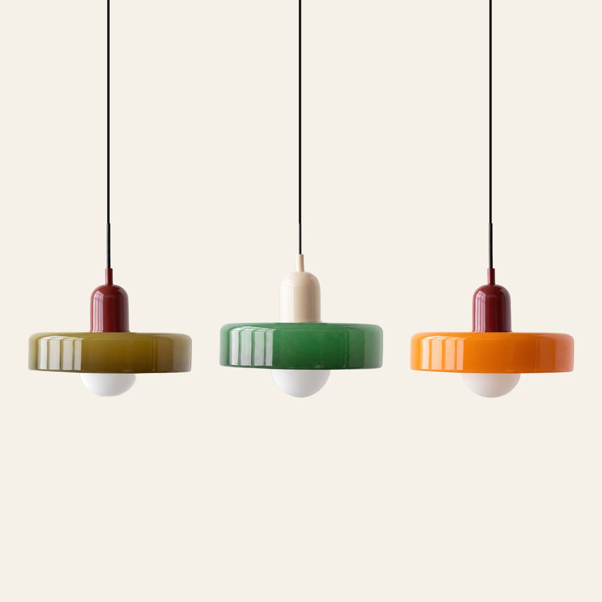 Welwyn pendant light in olive and burgundy, green and cream, and orange and burgundy side by side