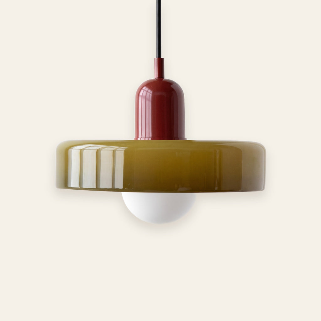 Welwyn mid century glass pendant light, olive glass disc with a burgundy cap, on a cream background