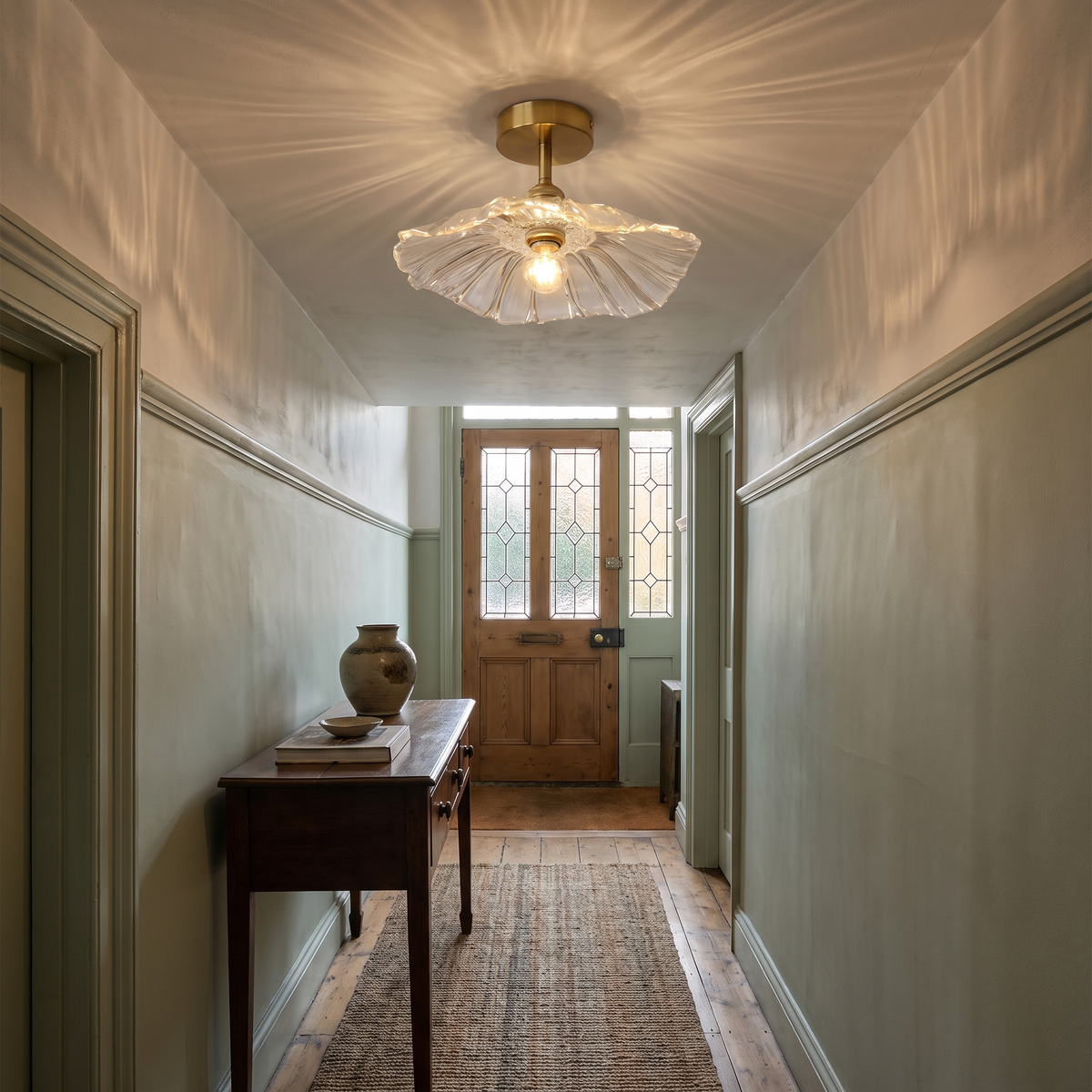 Woodbridge fluted glass flush ceiling light on the low ceiling of a period hallway