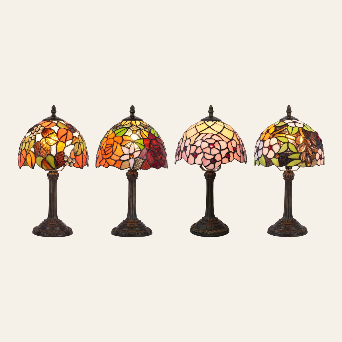 The Woolpit stained glass table lamp in its four designs side by side