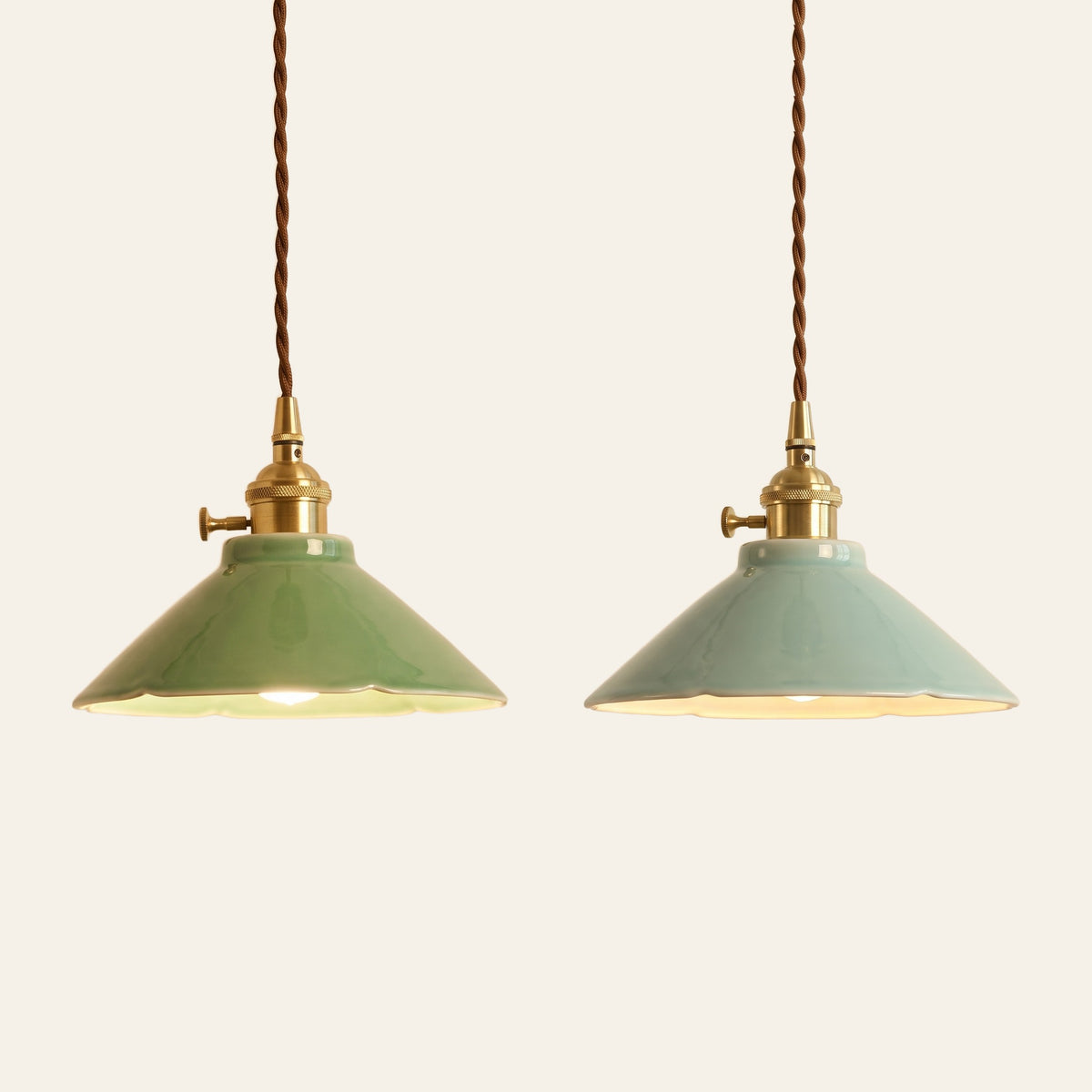 The Wortham pendant light in jade green and celadon side by side