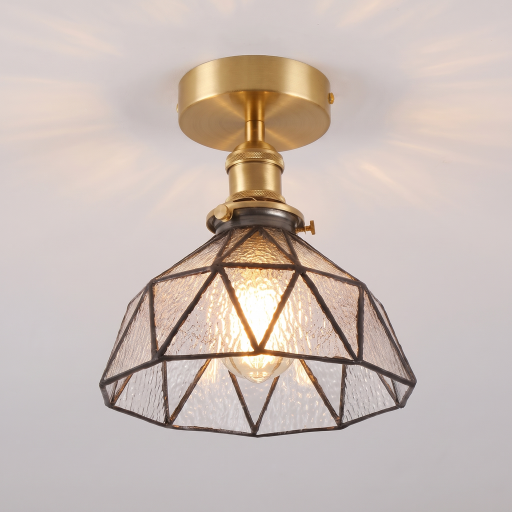 Close up of a lit clear Wrentham shade showing the textured glass panels and dark leading