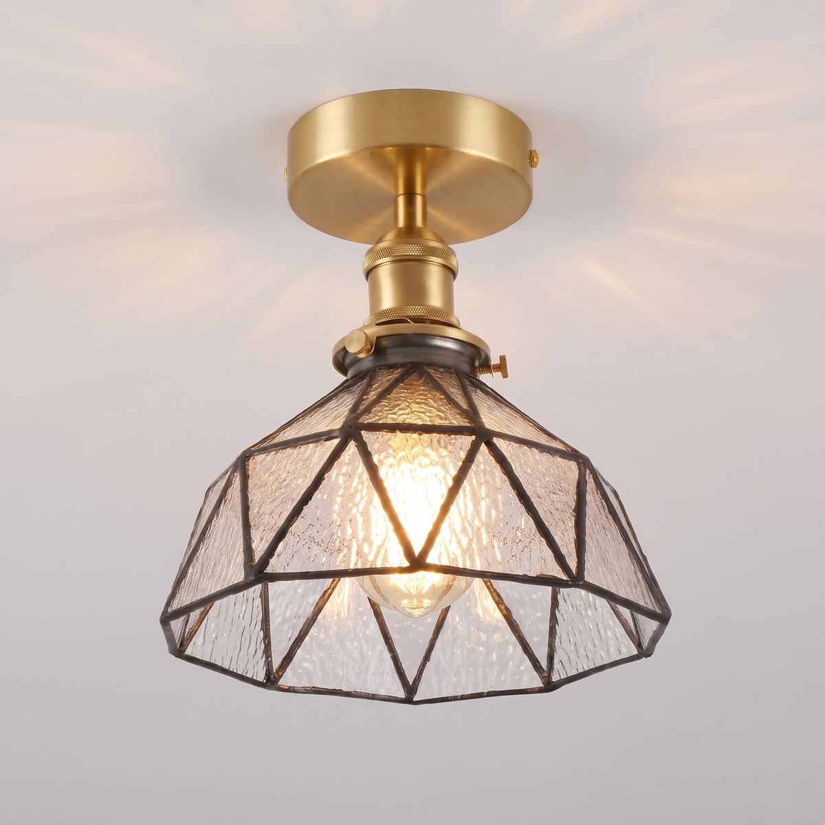 Close up of a lit clear Wrentham shade showing the textured glass panels and dark leading