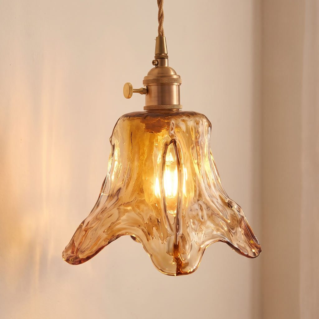 Close up of the Yaxley amber hammered glass lily shade and the knurled holder with its turn knob, lit