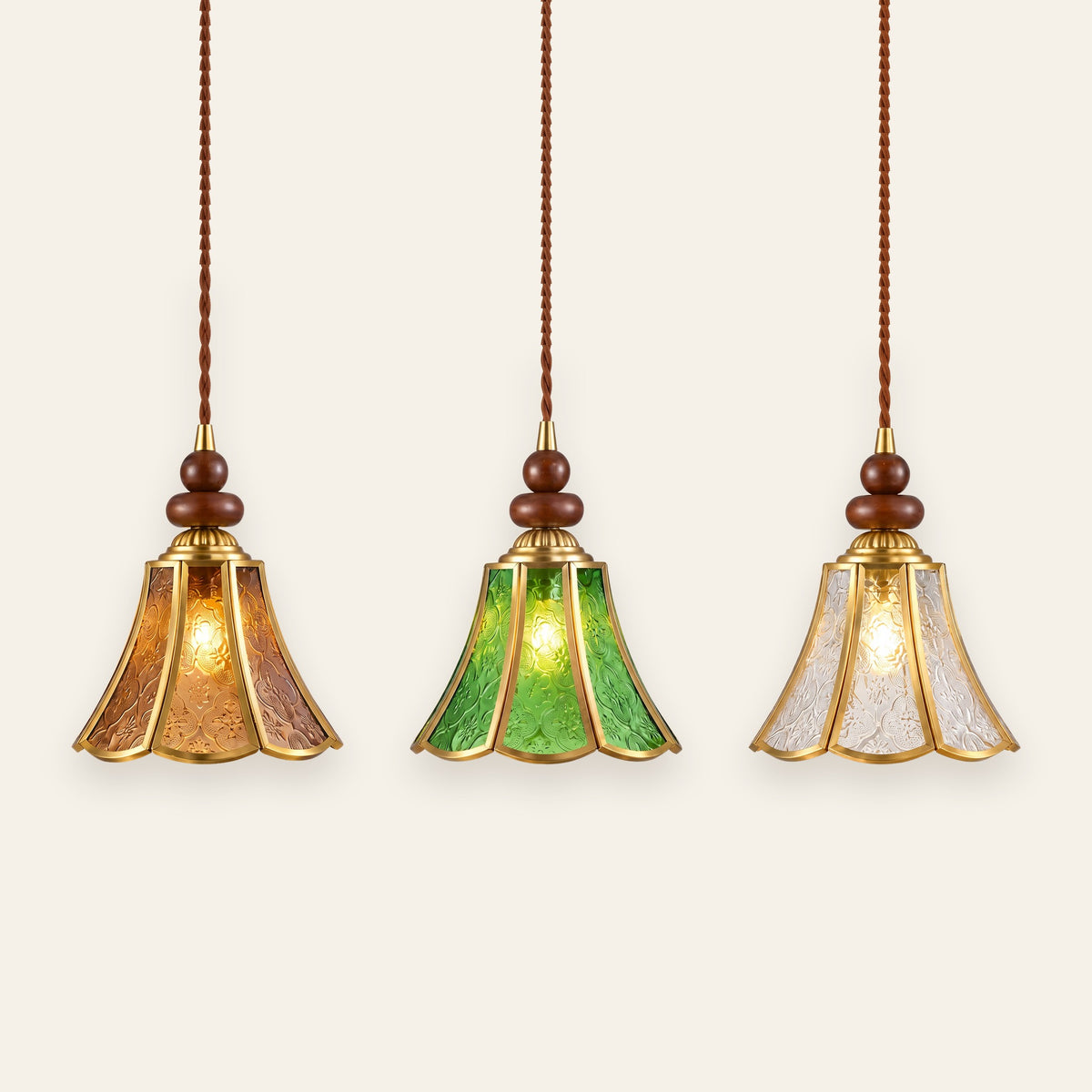 Yoxford pendant light in amber, green and clear embossed glass side by side