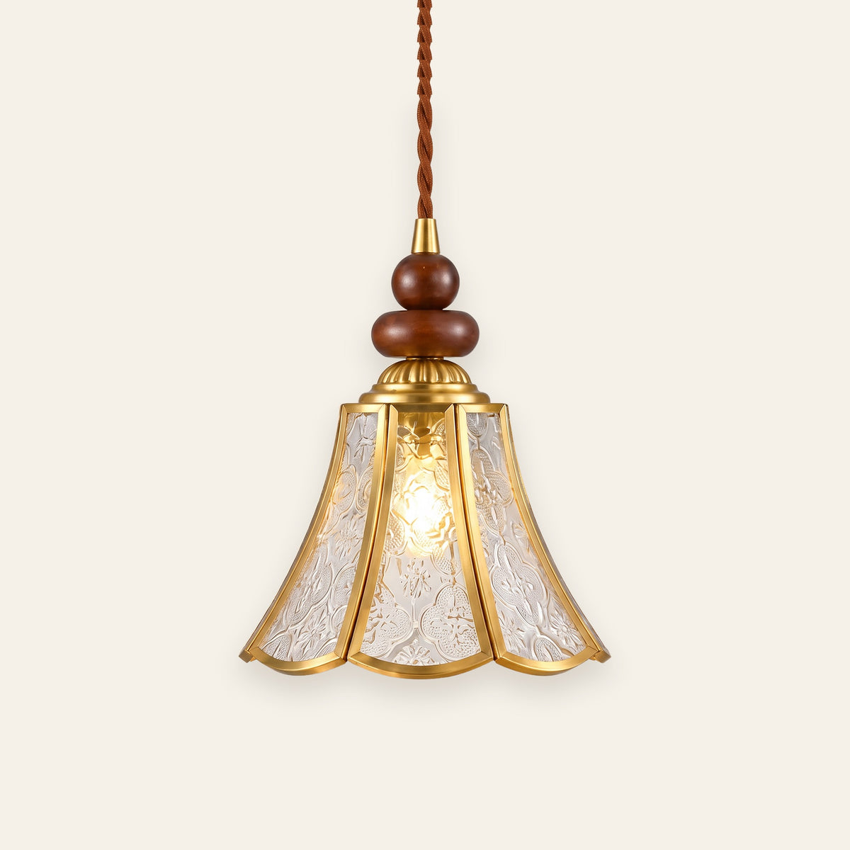 Yoxford pendant light with a clear embossed glass tulip shade, brass tone ribs and walnut tone wood beads, lit