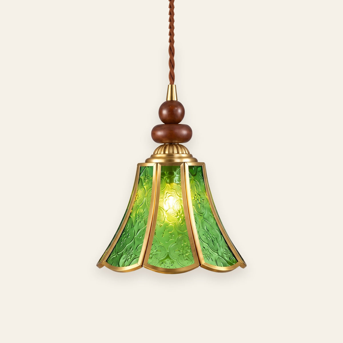 Yoxford pendant light with a green embossed glass tulip shade, brass tone ribs and walnut tone wood beads, lit